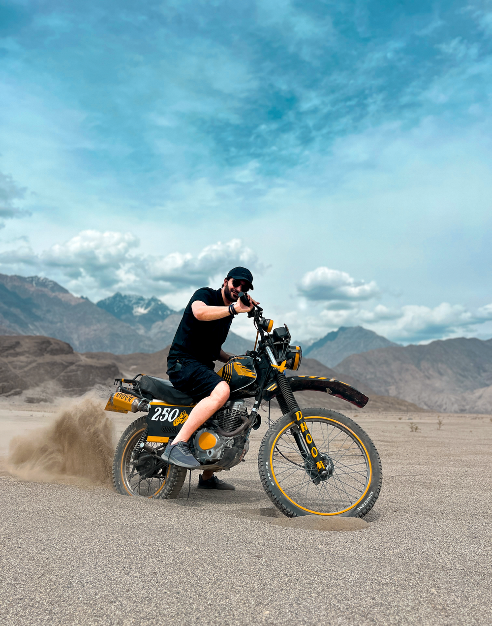 CASIDOR founder on a motorcycle in a mountain landscape